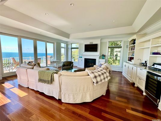 Fireplace, Interior, Living room, Recessed Lighting, Water, Wood Texture Flooring