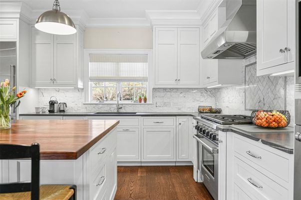 Interior, Kitchen, Marble Walls, Pendant Lights, Stainless Steel Appliances, Wood Texture Flooring