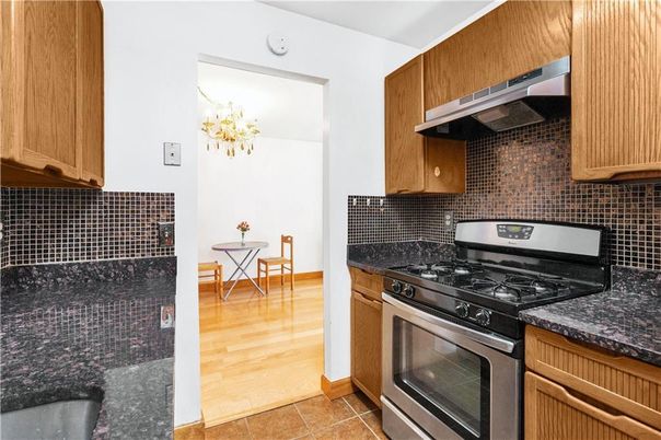 Chandelier, Dining room, Interior, Kitchen, Stainless Steel Appliances, Wood Texture Flooring