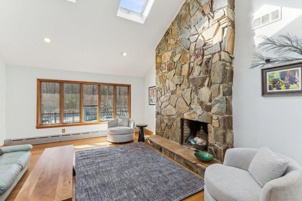 Fireplace, Interior, Living room, Recessed Lighting, Stone Walls, Wood Texture Flooring
