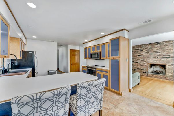 Fireplace, Interior, Kitchen, Recessed Lighting, Stone Walls, Wood Texture Flooring