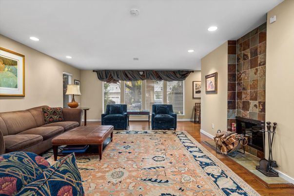 Fireplace, Interior, Living room, Recessed Lighting, Stone Walls, Wood Texture Flooring