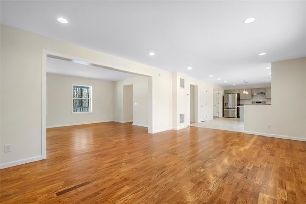 Empty room, Interior, Kitchen, Pendant Lights, Recessed Lighting, Stainless Steel Appliances, Wood Texture Flooring