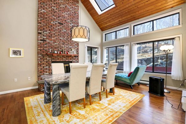 Dining room, Fireplace, Interior, Pendant Lights, Stone Walls, Wooden Ceilings, Wood Texture Flooring