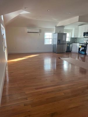 Empty room, Interior, Kitchen, Recessed Lighting, Stainless Steel Appliances, Wood Texture Flooring