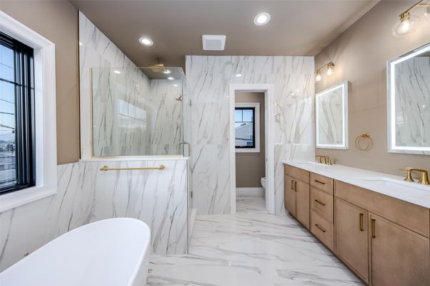Bathroom, Dual Sink Vanities, Free Standing Baths, Interior, Marble, Marble Walls, Recessed Lighting