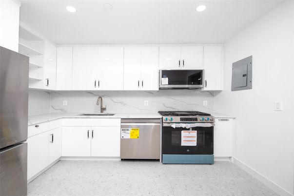 Interior, Kitchen, Marble Walls, Recessed Lighting, Stainless Steel Appliances