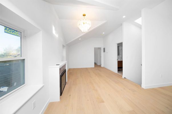Chandelier, Empty room, Fireplace, Interior, Recessed Lighting, Wood Texture Flooring