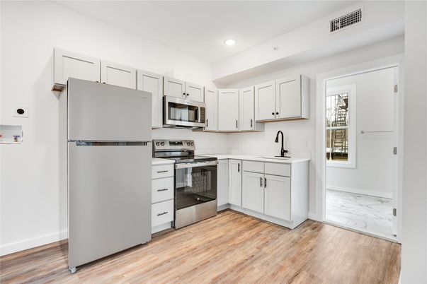 Interior, Kitchen, Marble, Recessed Lighting, Stainless Steel Appliances, Wood Texture Flooring