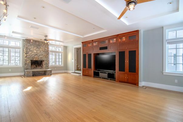 Empty room, Fireplace, Interior, Recessed Lighting, Stone Walls, Wood Texture Flooring