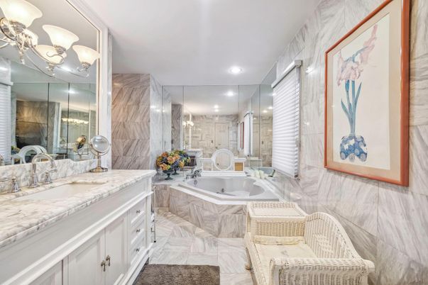 Bathroom, Dual Sink Vanities, Glass Shower, Interior, Marble, Marble Walls, Recessed Lighting