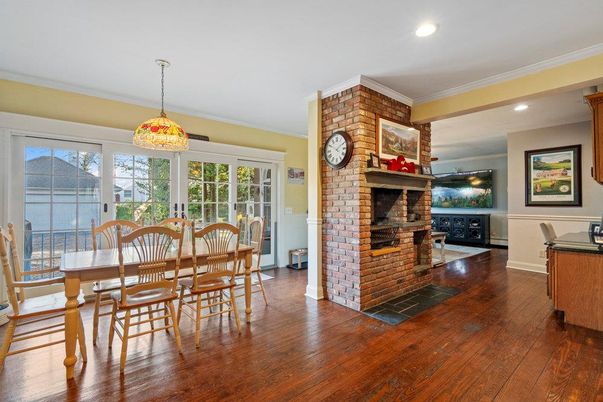 Dining room, Fireplace, Interior, Pendant Lights, Recessed Lighting, Stone Walls, Wood Texture Flooring