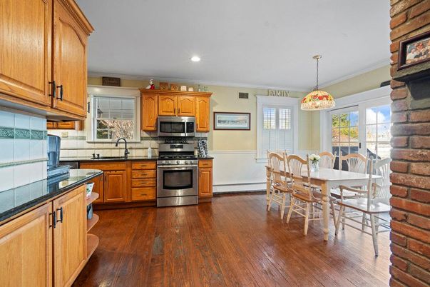 Dining room, Interior, Kitchen, Pendant Lights, Recessed Lighting, Stainless Steel Appliances, Wood Texture Flooring