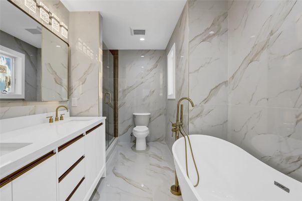 Bathroom, Dual Sink Vanities, Free Standing Baths, Interior, Marble, Marble Walls, Recessed Lighting