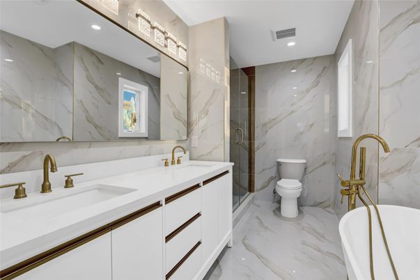 Bathroom, Dual Sink Vanities, Free Standing Baths, Interior, Marble, Marble Walls, Recessed Lighting