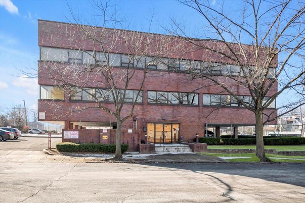 Exterior, Facade, Brick Facade, Condo Building