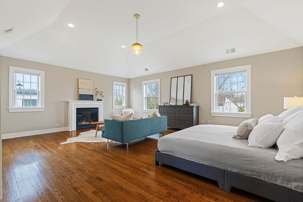 Bedroom, Fireplace, Interior, Pendant Lights, Recessed Lighting, Wood Texture Flooring