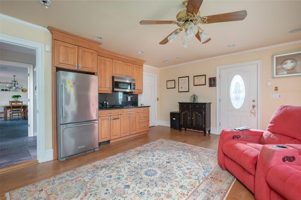 Dining room, Interior, Kitchen, Living room, Recessed Lighting, Stainless Steel Appliances, Wood Texture Flooring
