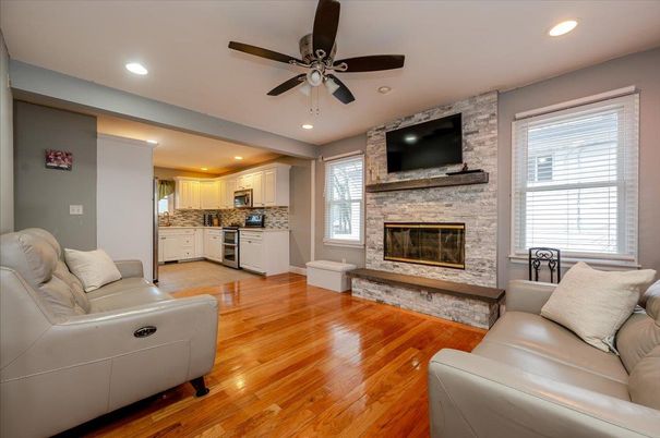 Fireplace, Interior, Kitchen, Living room, Recessed Lighting, Stone Walls, Wood Texture Flooring