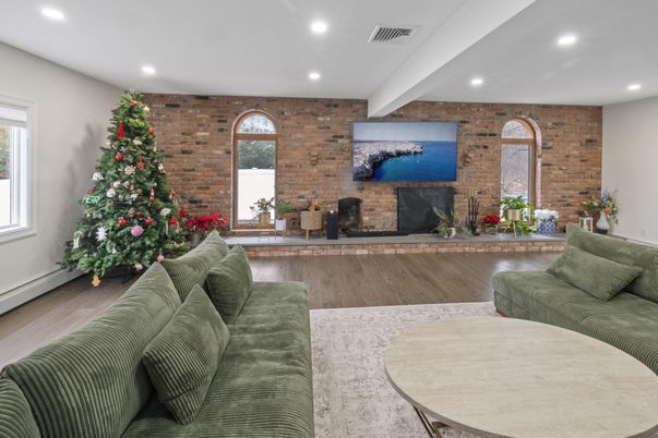 Fireplace, Interior, Living room, Recessed Lighting, Stone Walls, Wood Texture Flooring