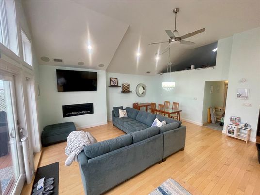 Dining room, Fireplace, Interior, Living room, Pendant Lights, Recessed Lighting, Wood Texture Flooring