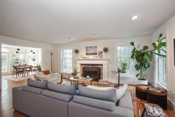 Dining room, Fireplace, Interior, Living room, Recessed Lighting, Wood Texture Flooring