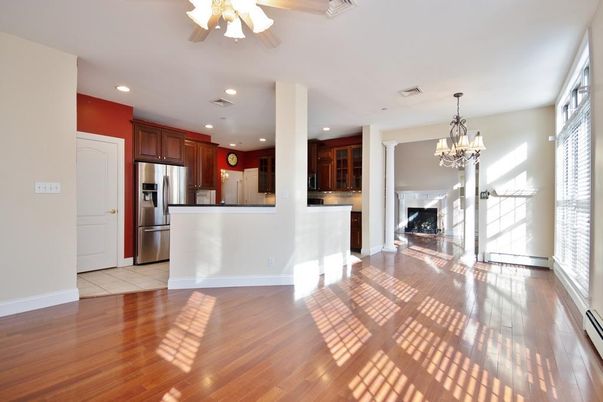 Chandelier, Fireplace, Interior, Kitchen, Recessed Lighting, Stainless Steel Appliances, Wood Texture Flooring
