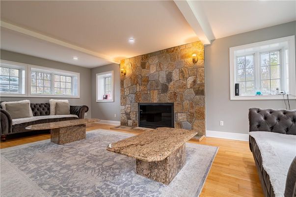 Fireplace, Interior, Living room, Recessed Lighting, Stone Walls, Wood Texture Flooring