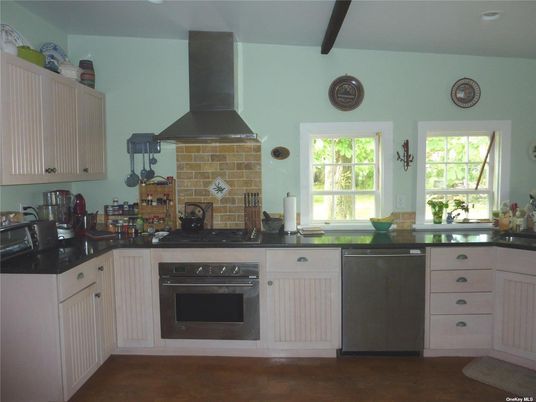 Fireplace, Interior, Kitchen, Recessed Lighting, Stainless Steel Appliances, Stone Walls, Wood Texture Flooring