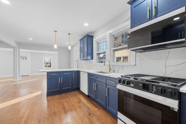 Interior, Kitchen, Marble Walls, Pendant Lights, Recessed Lighting, Stainless Steel Appliances, Wood Texture Flooring