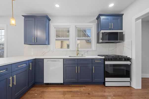 Interior, Kitchen, Marble Walls, Pendant Lights, Recessed Lighting, Stainless Steel Appliances, Wood Texture Flooring