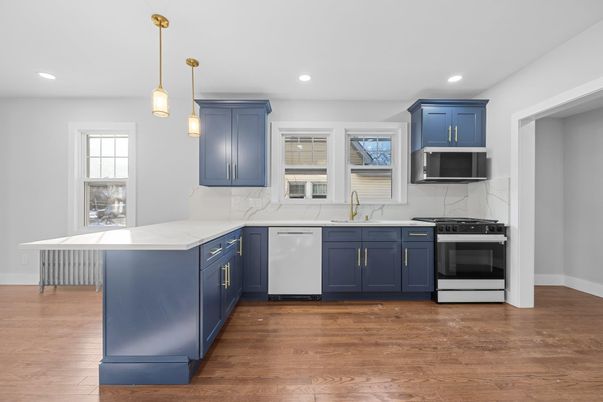 Interior, Kitchen, Marble Walls, Pendant Lights, Recessed Lighting, Stainless Steel Appliances, Wood Texture Flooring