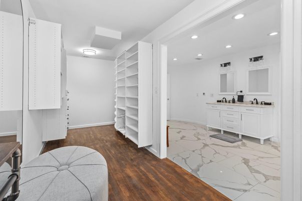Bathroom, Dual Sink Vanities, Interior, Marble, Recessed Lighting, Walk-in Closets, Wood Texture Flooring