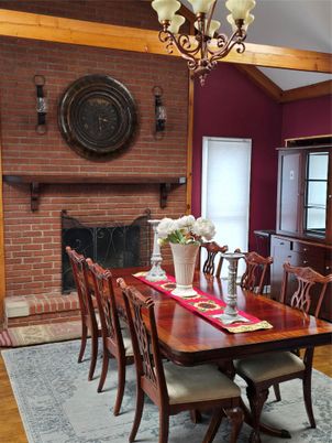 Chandelier, Dining room, Fireplace, Interior, Stone Walls, Wooden Beams, Wood Texture Flooring