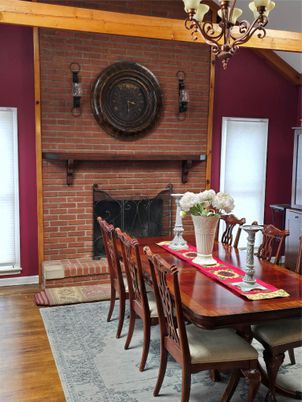 Chandelier, Dining room, Fireplace, Interior, Stone Walls, Wood Texture Flooring