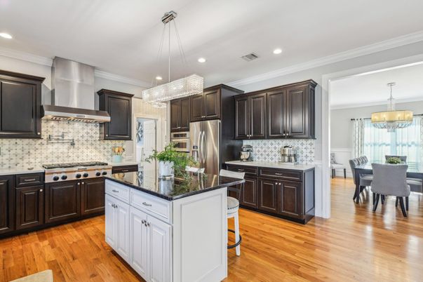 Chandelier, Dining room, Interior, Kitchen, Pendant Lights, Recessed Lighting, Stainless Steel Appliances, Wood Texture Flooring