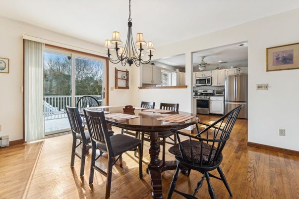 Chandelier, Dining room, Interior, Kitchen, Stainless Steel Appliances, Wood Texture Flooring