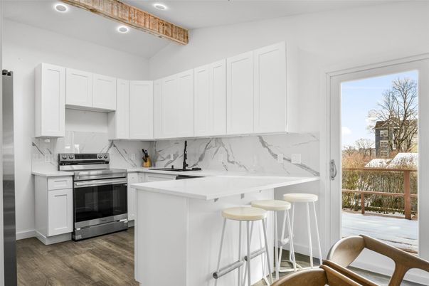 Interior, Kitchen, Marble Walls, Recessed Lighting, Stainless Steel Appliances, Wood Texture Flooring