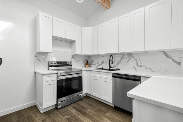 Interior, Kitchen, Marble Walls, Recessed Lighting, Stainless Steel Appliances, Wood Texture Flooring