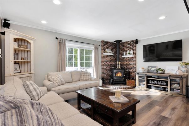 Fireplace, Interior, Living room, Recessed Lighting, Stone Walls, Wood Texture Flooring