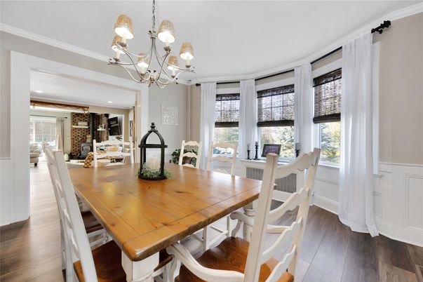 Chandelier, Dining room, Fireplace, Interior, Recessed Lighting, Stone Walls, Wood Texture Flooring