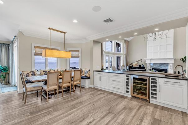 Dining room, Fireplace, Interior, Kitchen, Pendant Lights, Recessed Lighting, Water, Wood Texture Flooring