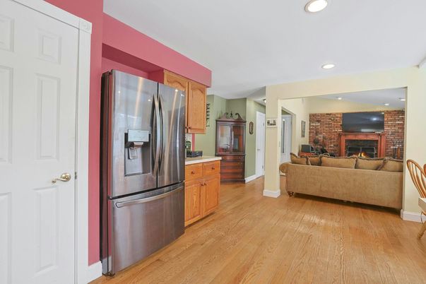 Fireplace, Interior, Kitchen, Living room, Recessed Lighting, Stainless Steel Appliances, Stone Walls, Wood Texture Flooring