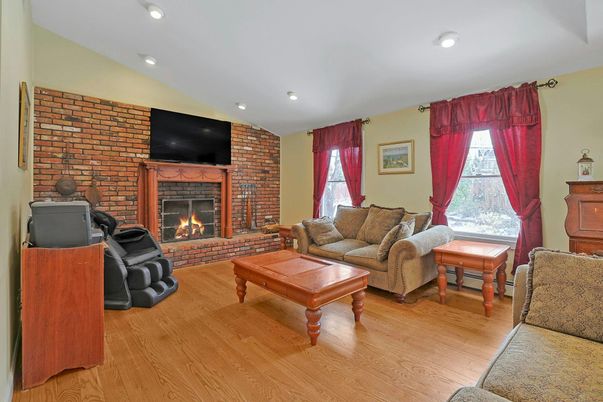 Fireplace, Interior, Living room, Recessed Lighting, Stone Walls, Wood Texture Flooring