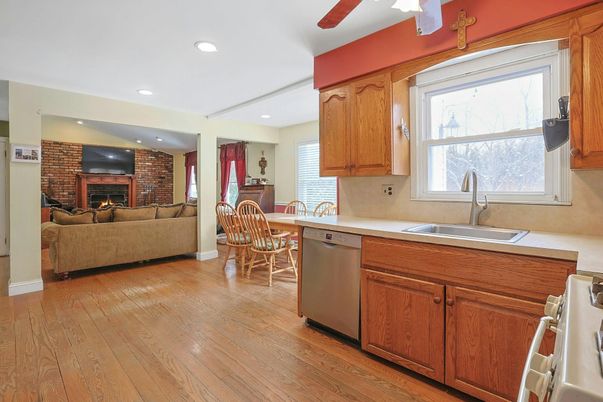 Dining room, Fireplace, Interior, Kitchen, Living room, Recessed Lighting, Stone Walls, Wood Texture Flooring
