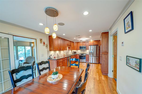 Dining room, Interior, Kitchen, Pendant Lights, Recessed Lighting, Stainless Steel Appliances, Wood Texture Flooring
