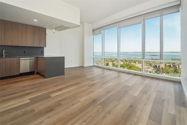 Empty room, Interior, Kitchen, Recessed Lighting, Water, Wood Texture Flooring