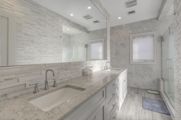 Bathroom, Dual Sink Vanities, Glass Shower, Interior, Marble Walls, Recessed Lighting, Wood Texture Flooring
