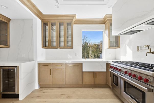 Interior, Kitchen, Marble Walls, Recessed Lighting, Stainless Steel Appliances, Wood Texture Flooring