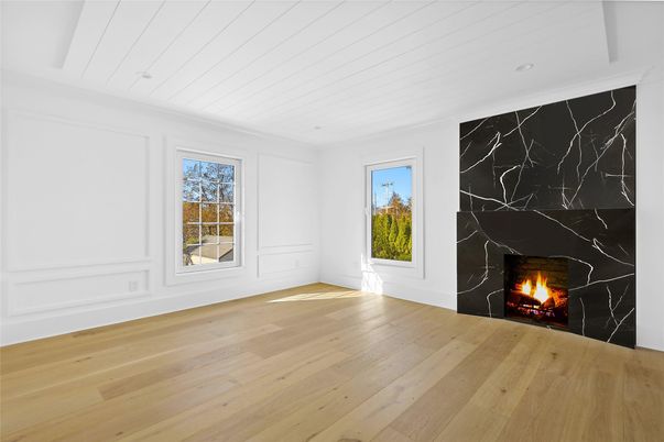 Empty room, Fireplace, Interior, Marble Walls, Recessed Lighting, Wood Texture Flooring